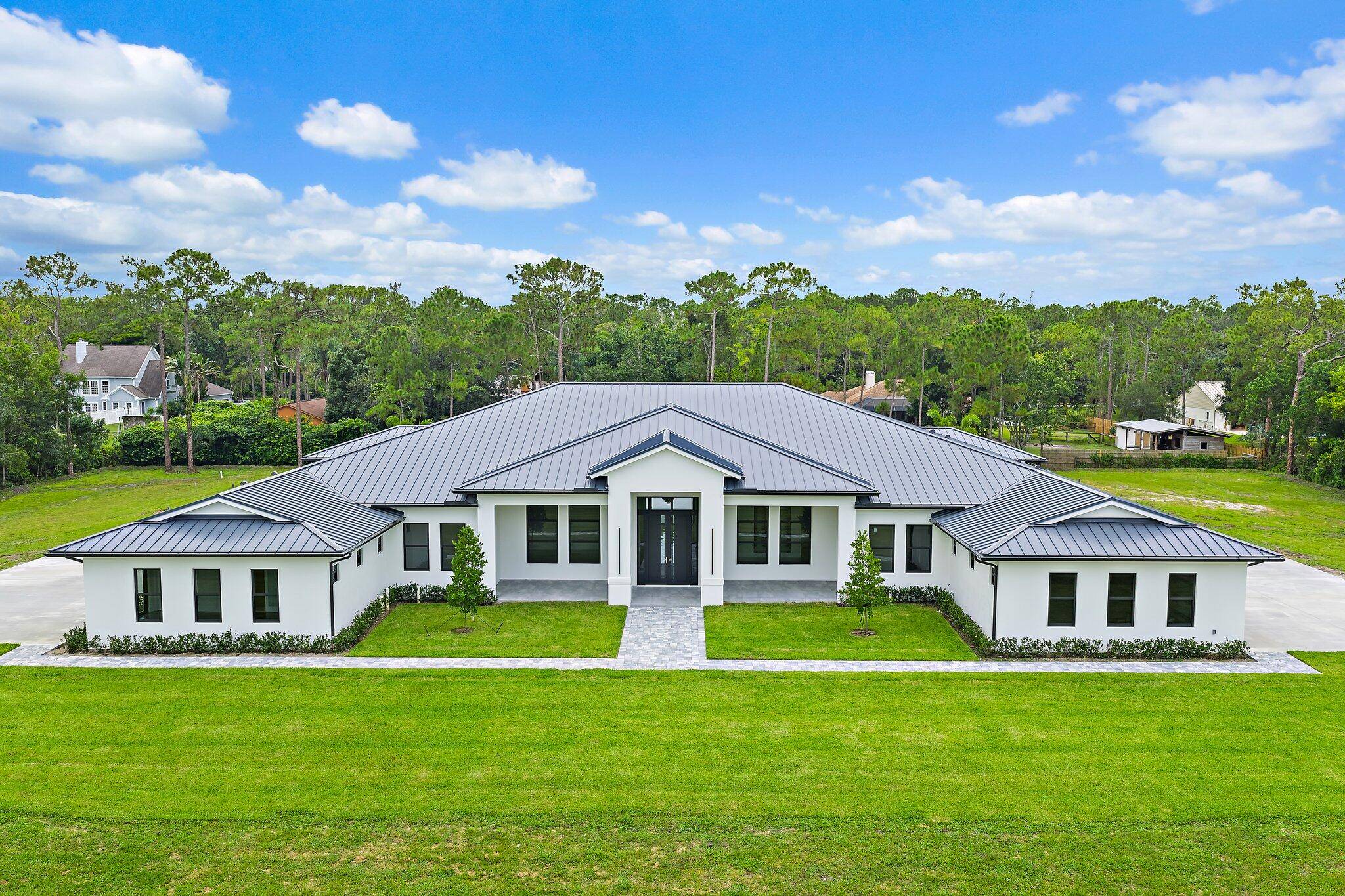 Brand new construction offering over 8, 200 sq ft of air conditioned living space, 10, 900 total sq ft, and an unmatched level of craftsmanship in Jupiter Farms.