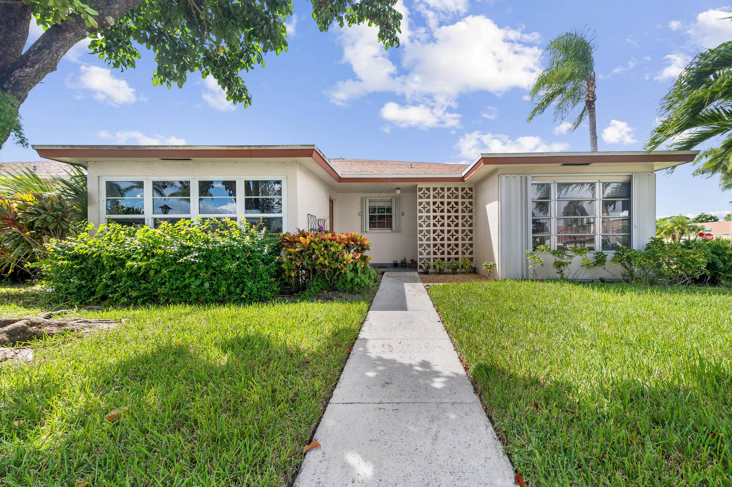 This beautifully renovated 2BR 2BA corner villa is filled with natural light and offers modern updates throughout, including sleek 30x30 tile flooring, an open concept kitchen with granite counters, backsplash, ...