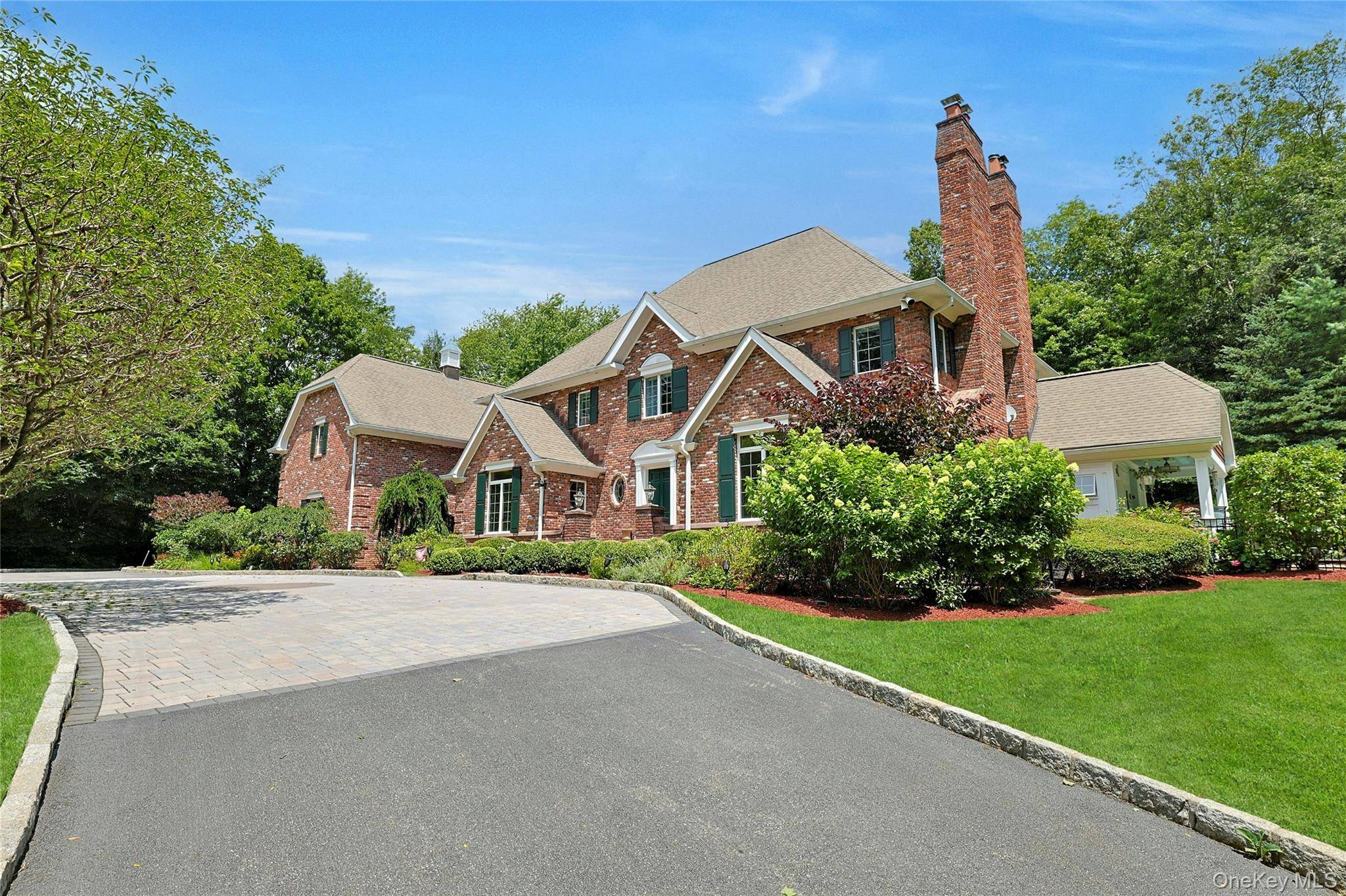 Welcome to this charming, brick Georgian colonial, set on 2 beautifully landscaped acres.
