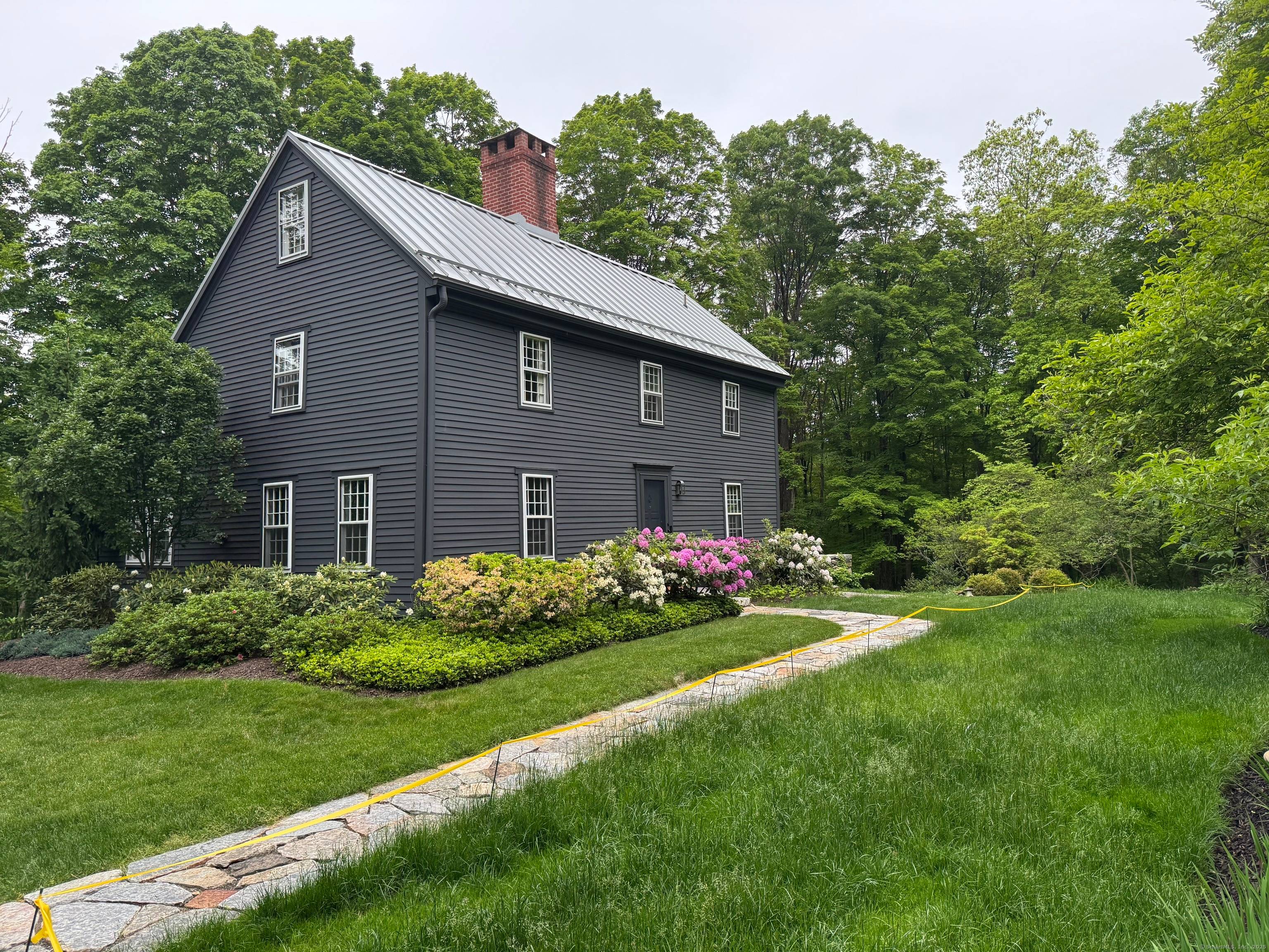 Escape and unwind in this exquisitely restored 1741 saltbox colonial the oldest home in Morris, CT !