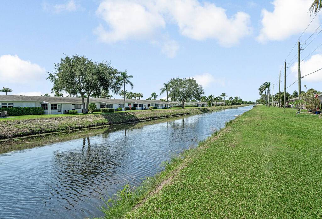 Affordable cozy 2 bedroom, 1 bathroom home featuring tile flooring throughout and a open backyard with a peaceful canal view.