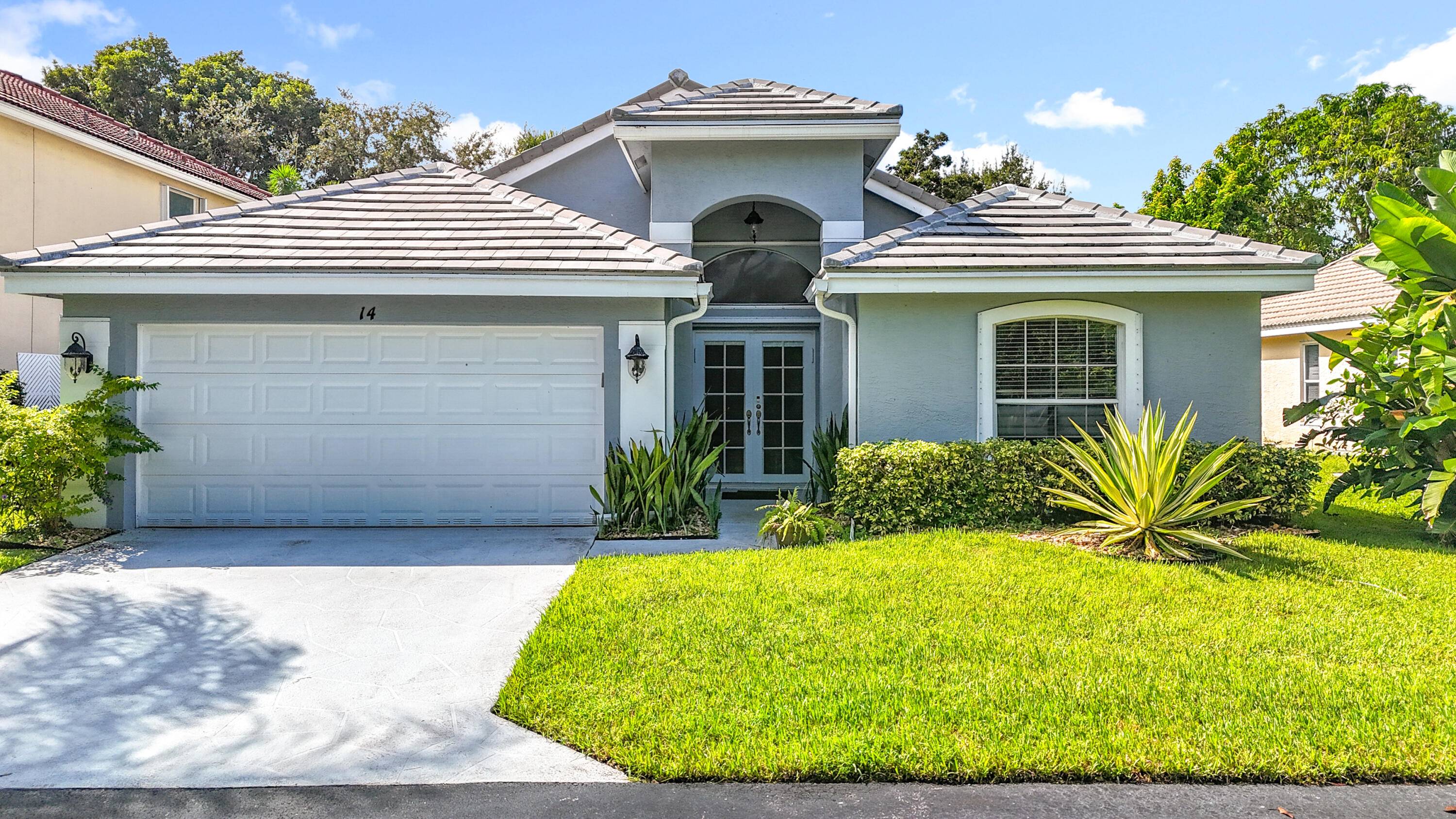 Rarely available remodeled three bedroom two and one half bath pool home in the exclusive gated community of Lawrence Lake Estates.