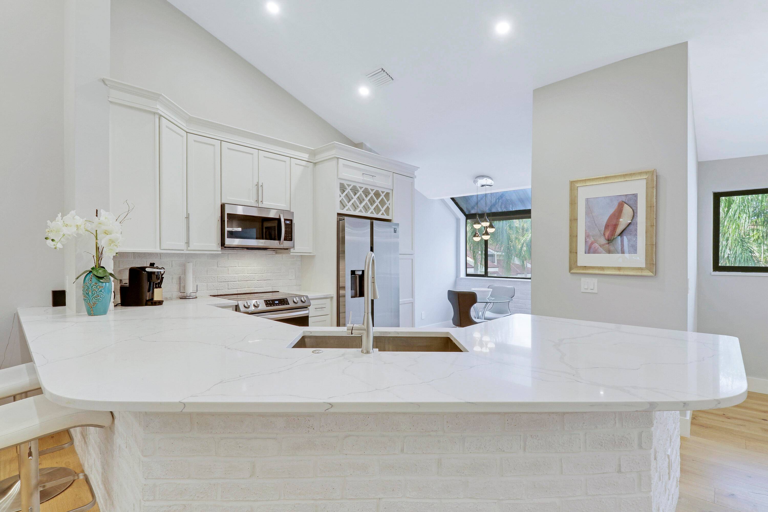 Enjoy paradise in this beautiful contemporary 2bedroom 2bathroom condo with one car garage at highly desirable community in Juno Beach.