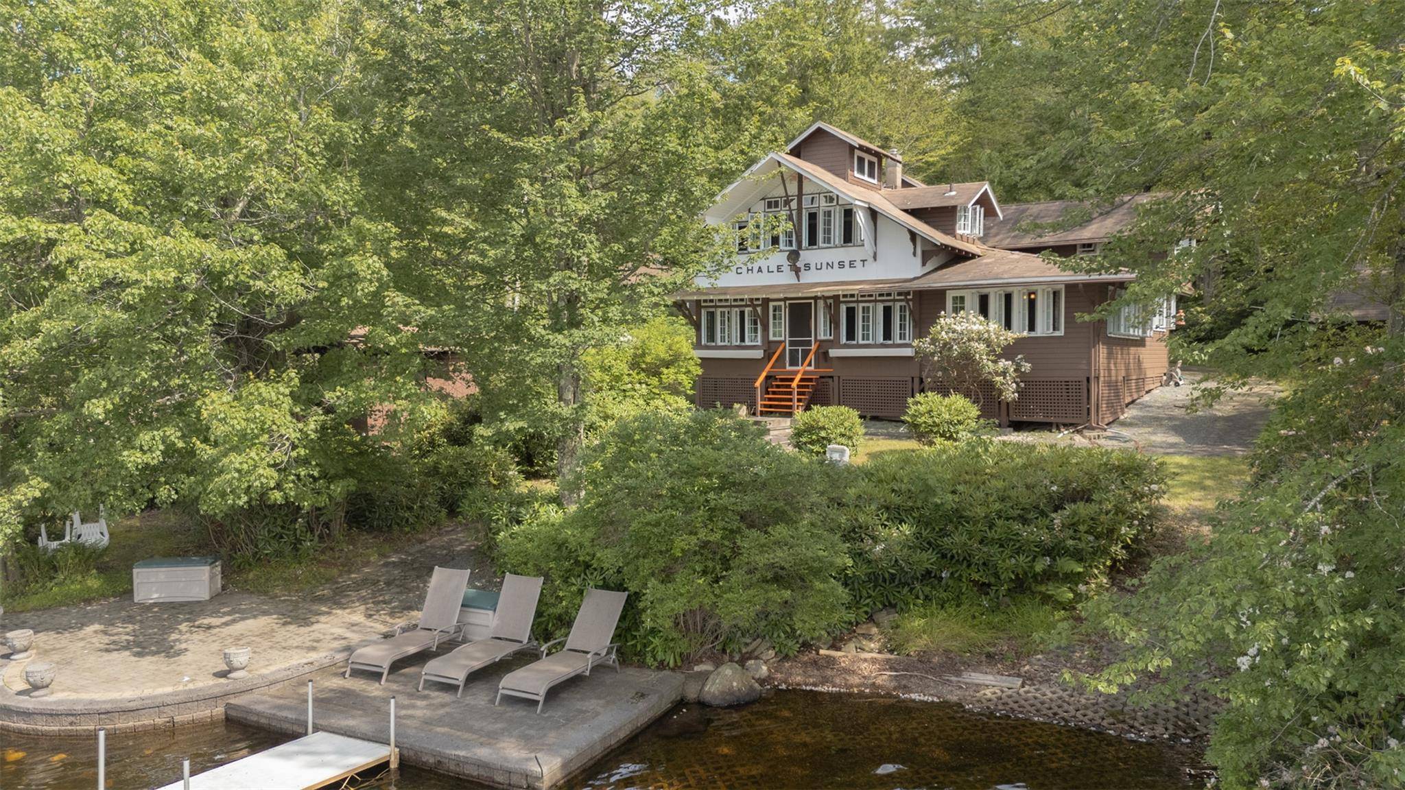 Nestled on an iconic 0. 77 acre lakefront parcel, Chalet Sunset offers a rare opportunity to own a nostalgic seasonal retreat in the heart of the cherished Wanaksink Lake community.
