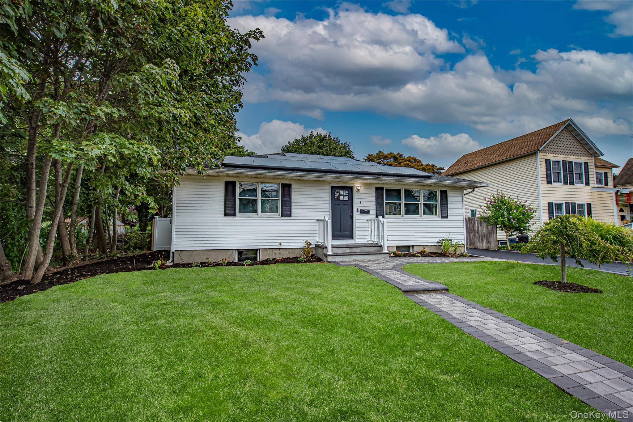 Welcome to 31 Terrel Street, where modern living meets classic comfort in this fully renovated ranch right in the heart of Patchogue.