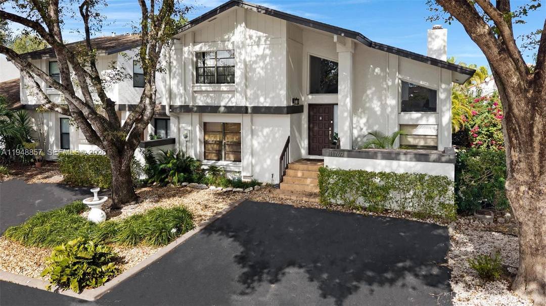 Beautiful 3 bedroom, 2 bath townhome featuring a cozy fireplace, exposed beams, and rich wood accents throughout.