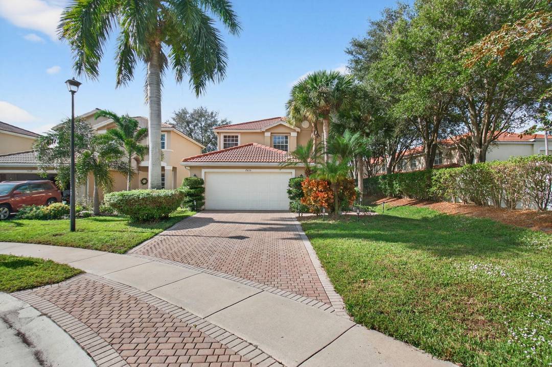 Embrace an elevated standard of living at 7533 Topiary Avenue, located in the appealing Greystone community of Boynton Beach, Florida.