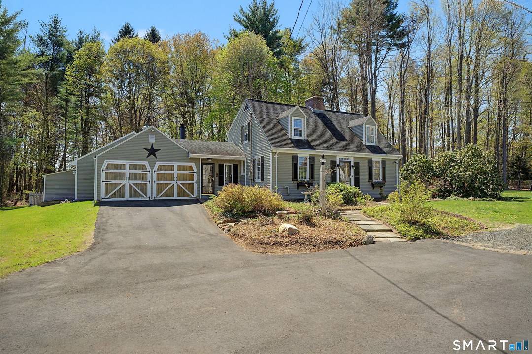 Nestled on a private, picturesque setting, welcome to this expanded and beautifully maintained Cape set on 2.