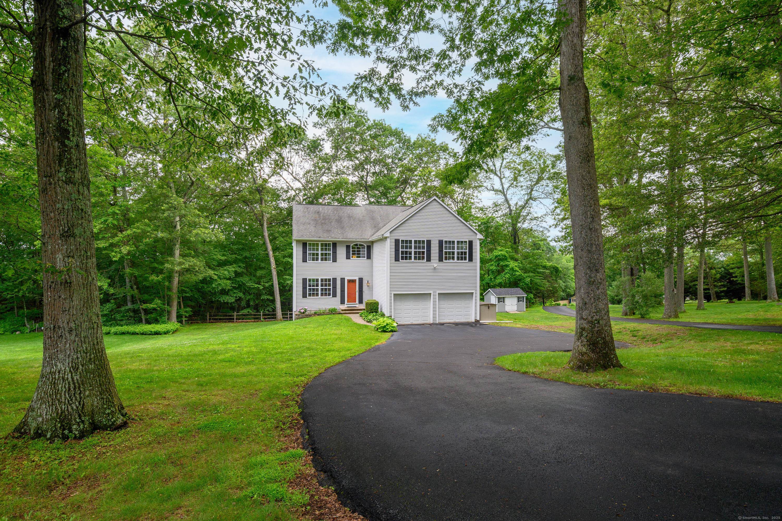 Welcome to 29 Littlebrook Lane, ideally set on just over an acre of beautifully maintained, level property.