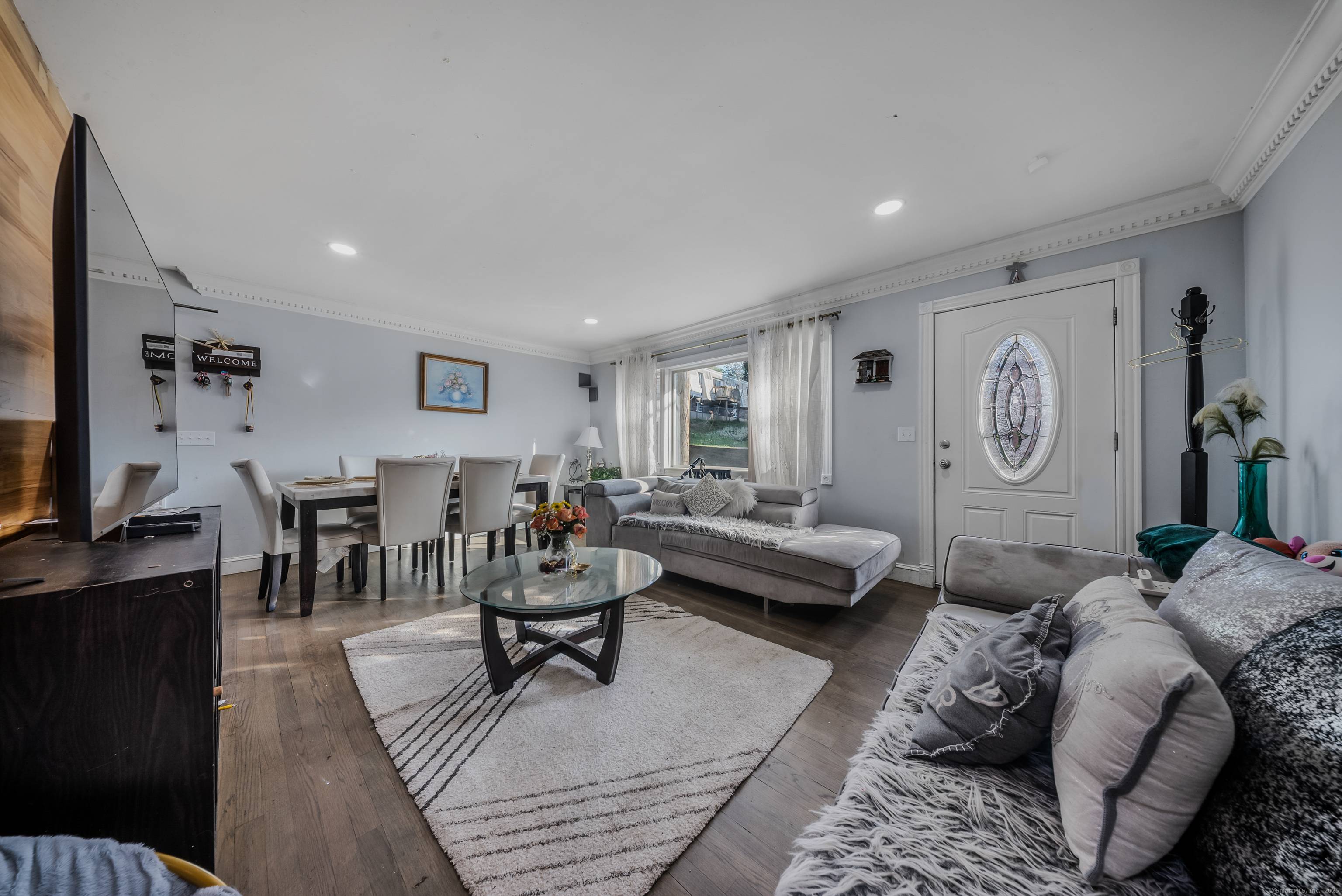 Modern 2 family house for sale, fully renovated and equipped with central air, on demand water heater, gas, and a private driveway and entrace for each unit.