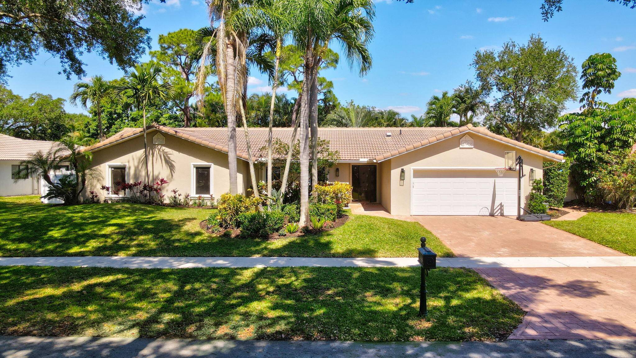 Located in the highly sought after gated community of Estancia, this charming and meticulously maintained 4 bedroom, 2.