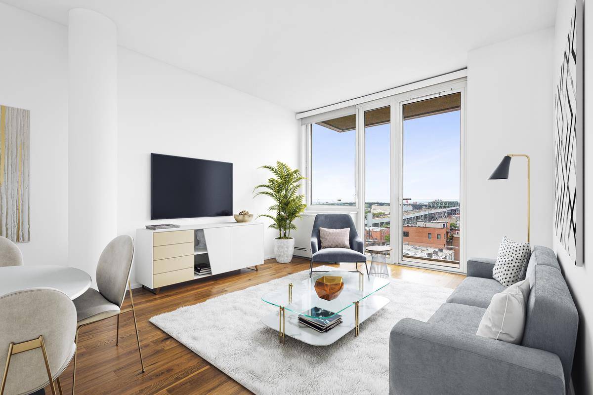 Large, sunny 1 Bed w Condo level Finishes, High Ceilings, and an in unit W D.