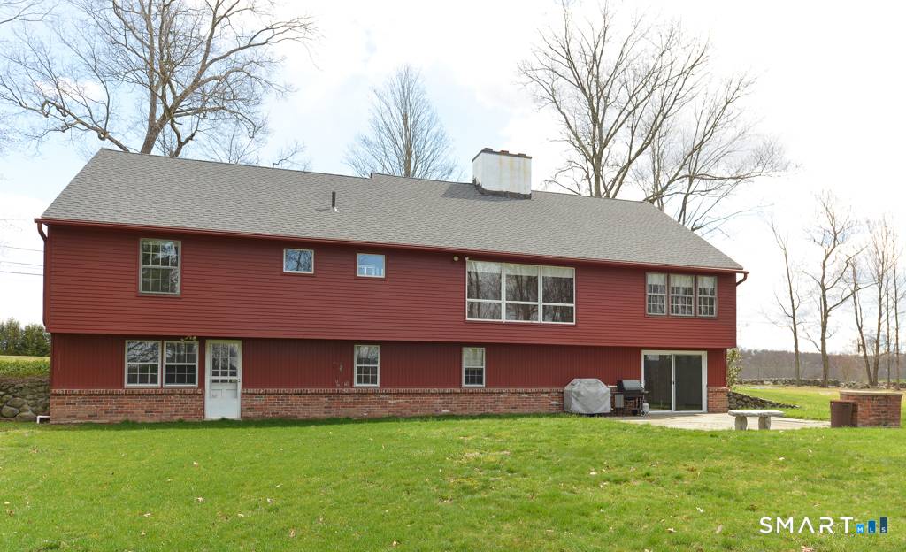 An incredible opportunity awaits near the end of a cul de sac overlooking the Country Club of Waterbury.