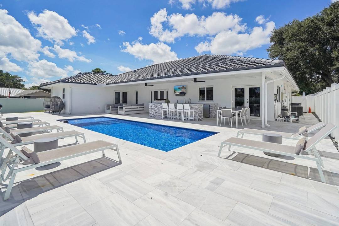 Fully renovated 4br, 2 1 2 bth contemporary pool home on oversized corner lot in Central Boca Raton !