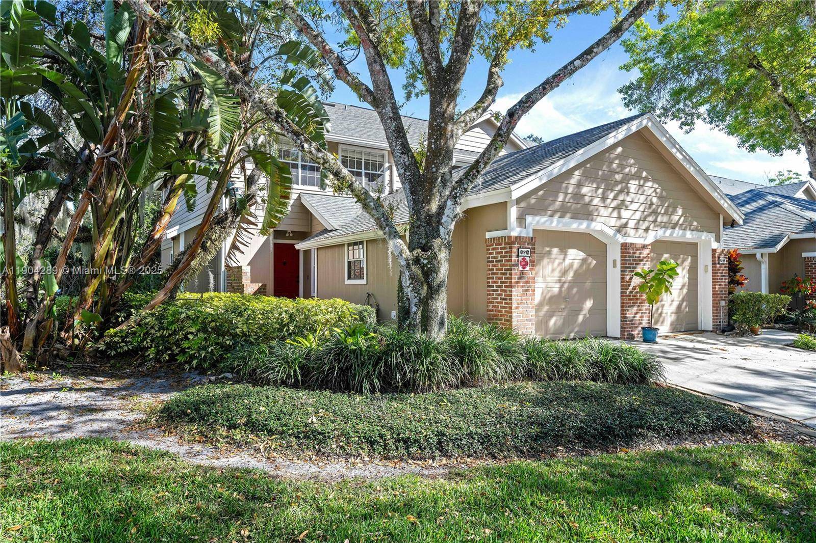 Stunning remodeled CORNER UNIT townhouse in the gated, lakefront community of Oak Harbour, Orlando.