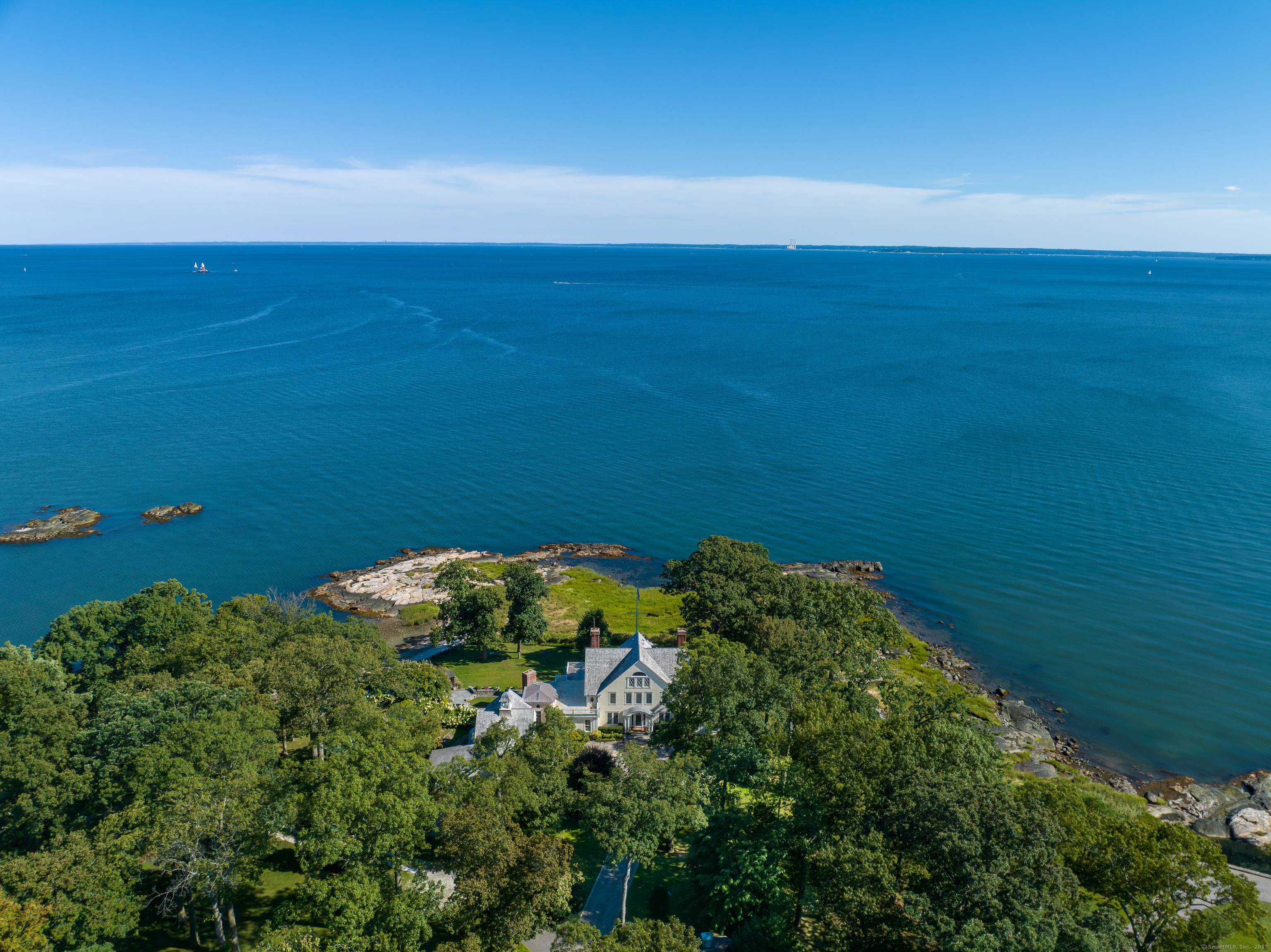 HAY ISLAND Breathtaking, unobstructed views of the Long Island Sound stretch from this private island at the end of a gated causeway on Darien's cherished waterfront coast.
