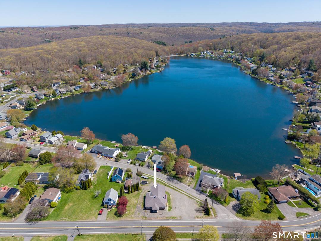 Exceptional redevelopment opportunity at 305 South Street in Plymouth, CT, directly across from beautiful Plymouth Lake.