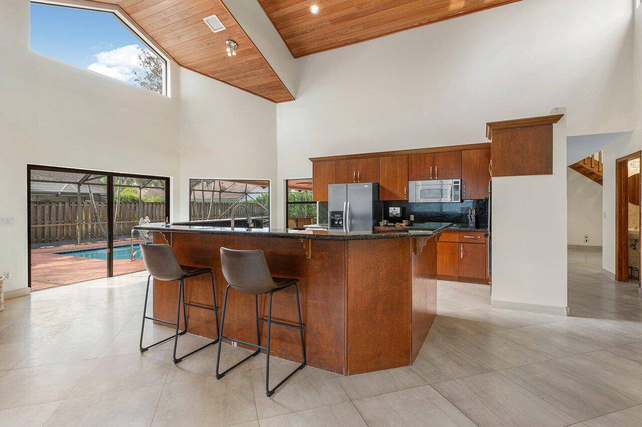 This beautiful large 5 Bedroom 4 bath Home with Pool is located in the heart of Wellington, FL in the desirable Chatsworth Village.