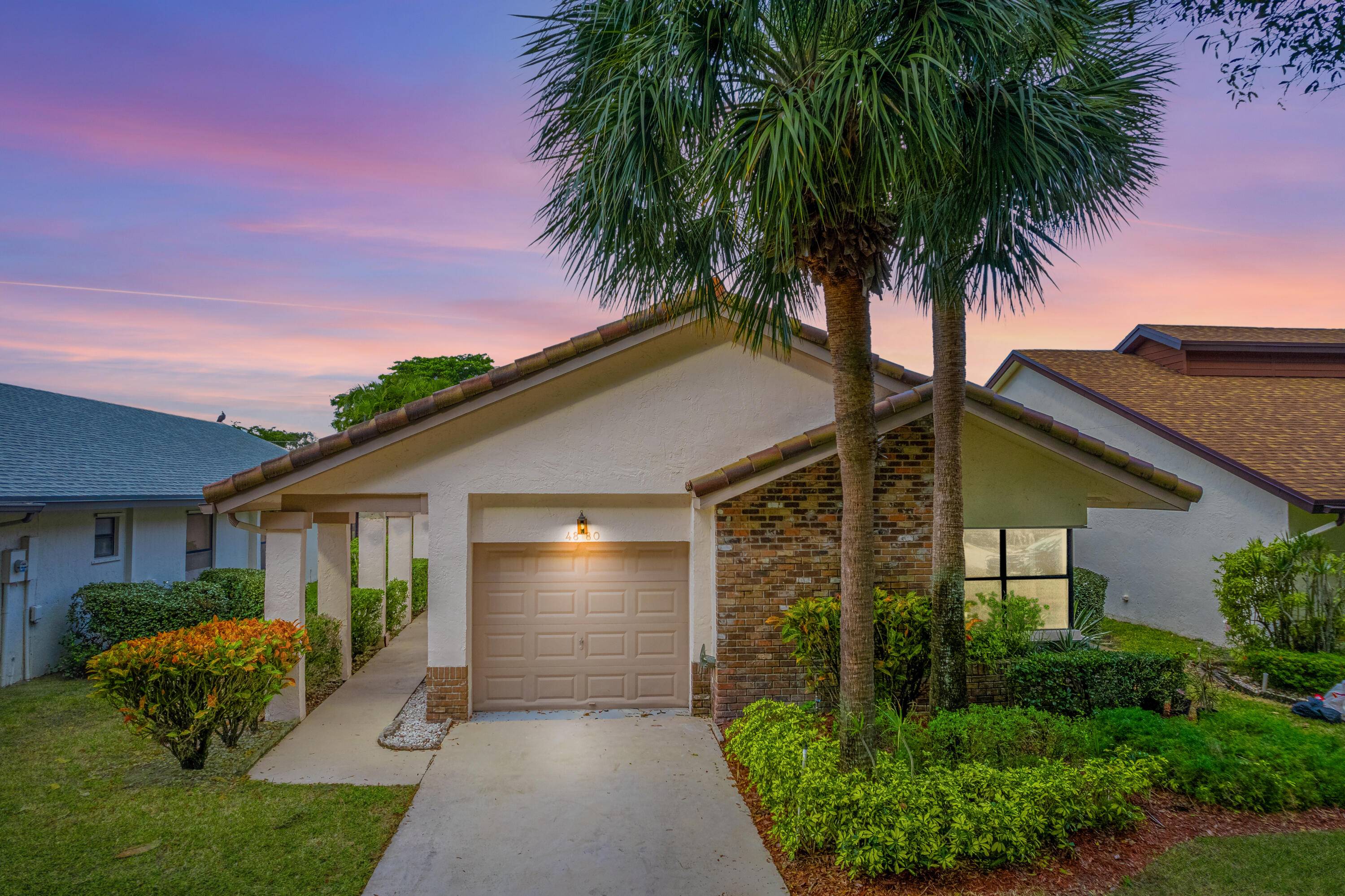 Welcome to your dream family home nestled in a serene gated community in the heart of Boynton Beach !