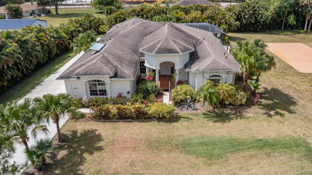 A rare find in West Palm Beach sprawling lot, no HOA, and a residence with incredible upside.