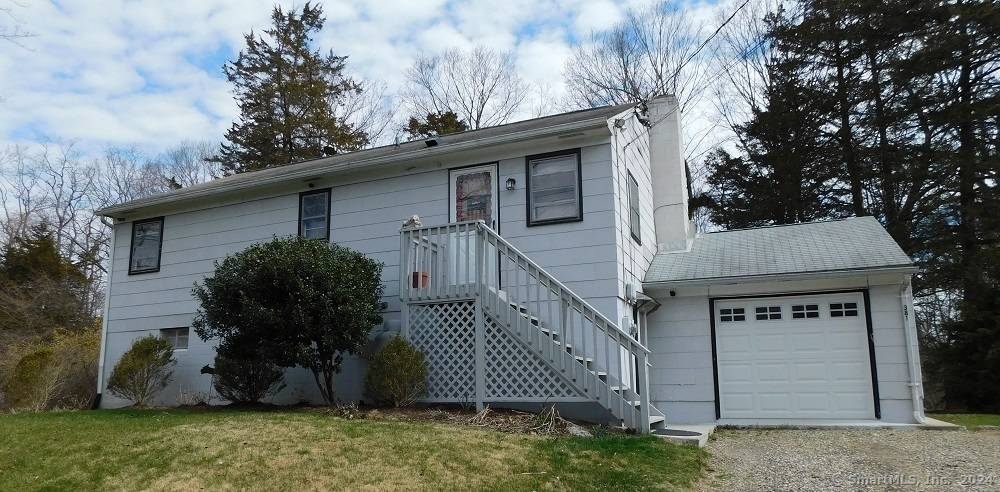 CHARMING COUNTRY HOME in the heart of Ridgefield, situated in a lovely neighborhood setting with winding country roads, lakes, ponds along the way.
