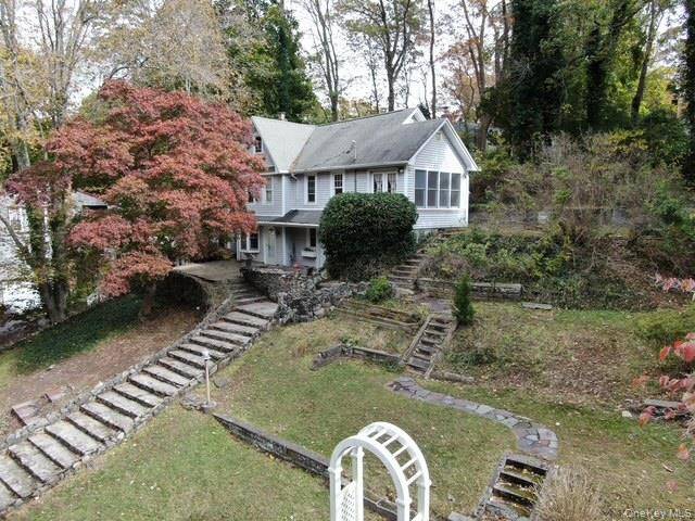 Welcome to 55 Woodhull Landing, a unique three level home perched on the hillside.