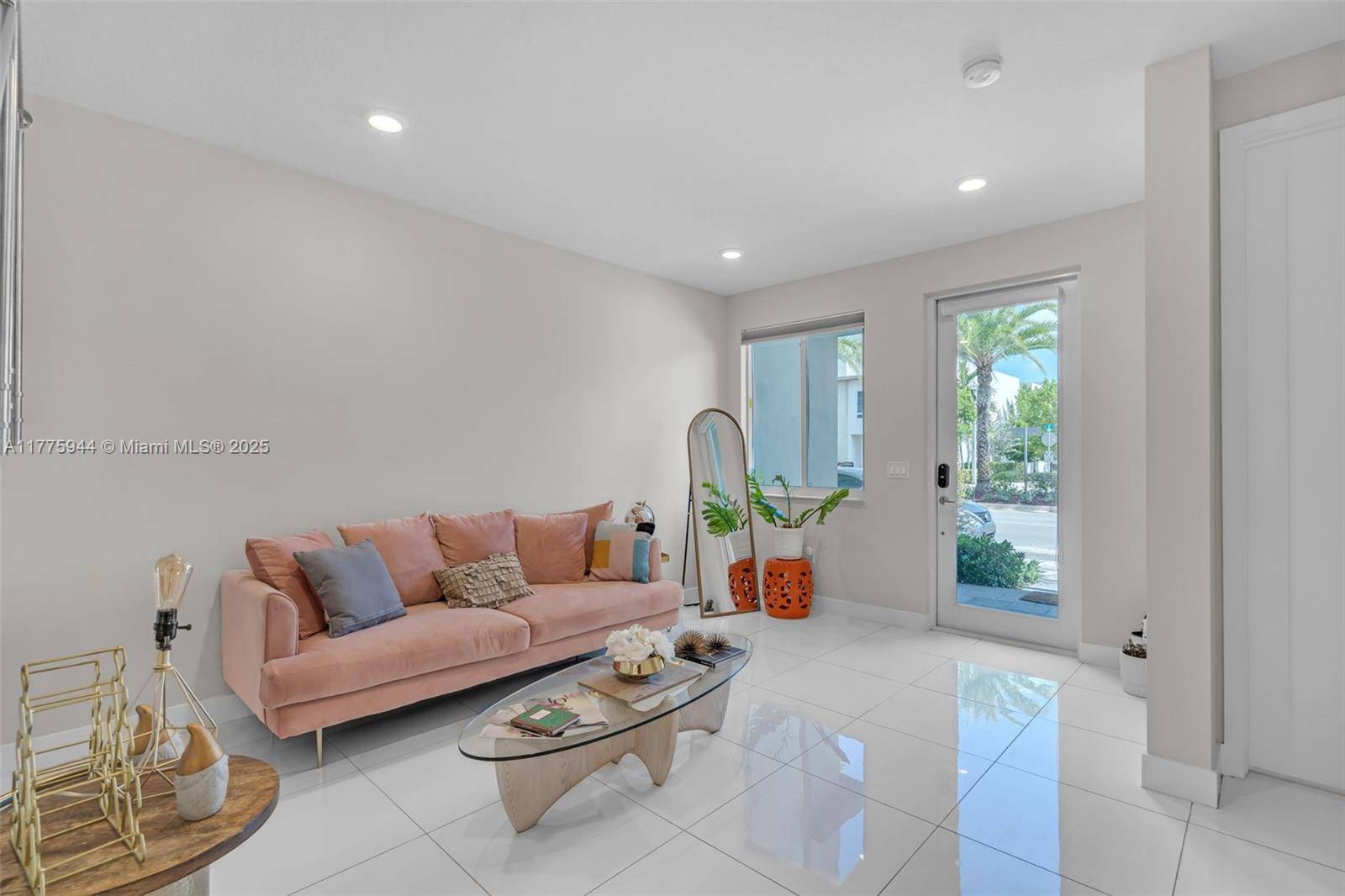 Step into elegance in this freshly painted townhouse at Landmark at Doral, where style meets comfort.