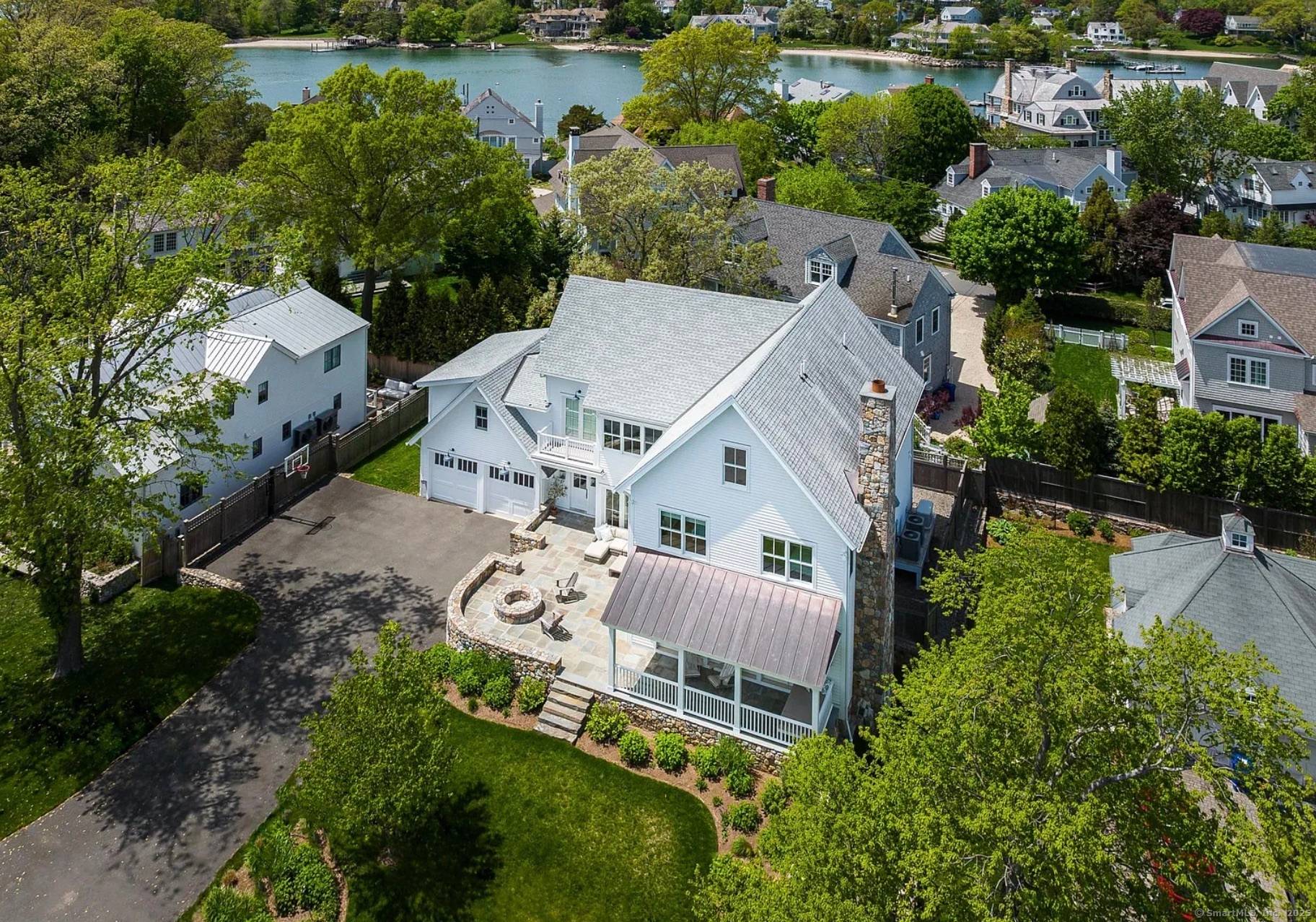 Situated on one of Rowayton's most coveted private streets within the Rowayton Beach Association RBA, this custom designed home embodies the very best of seaside living.