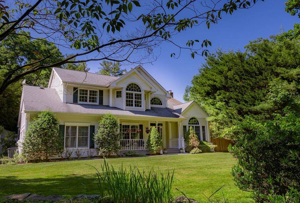Tucked away in a small pocket neighborhood in Stony Brook Village, this spacious 4 bedroom 3.