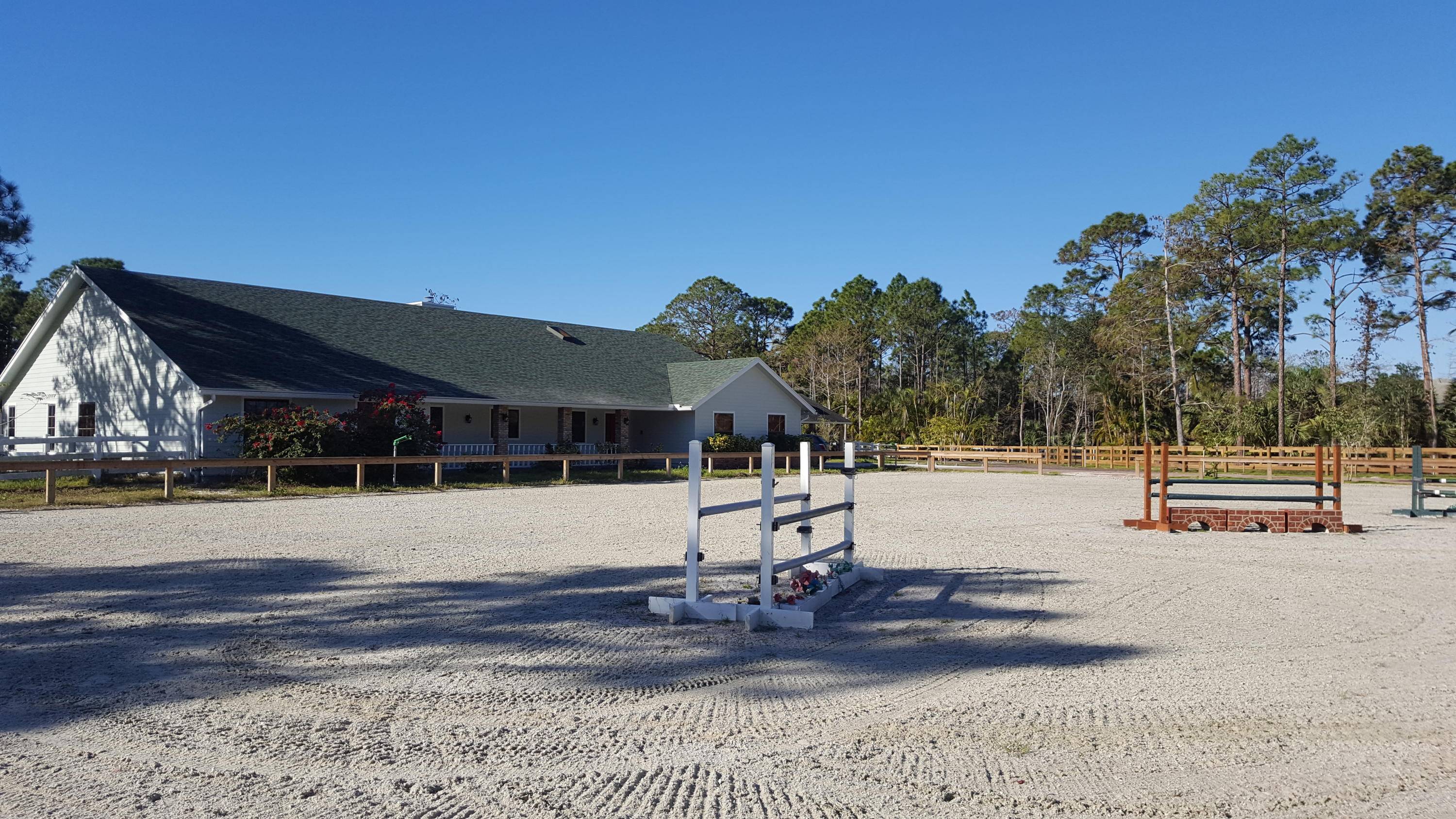 Beautiful 6 BR 3BA equestrian 'French Cottage' style home on one of the largest 2.