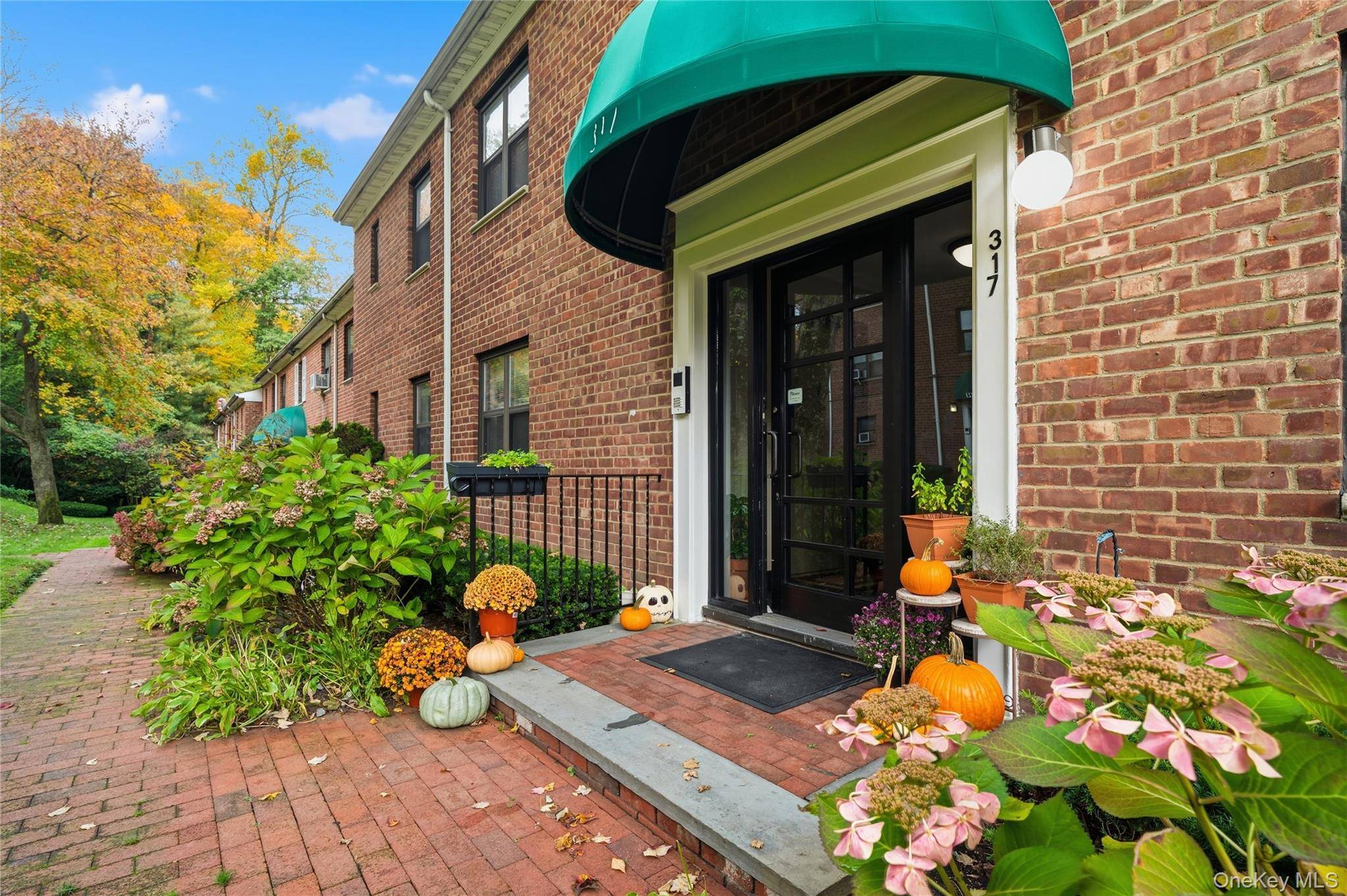 Warm and inviting updated 2 bedroom 1 bath co op, part of the beautiful Silver Hill development in the desirable town of Roslyn.