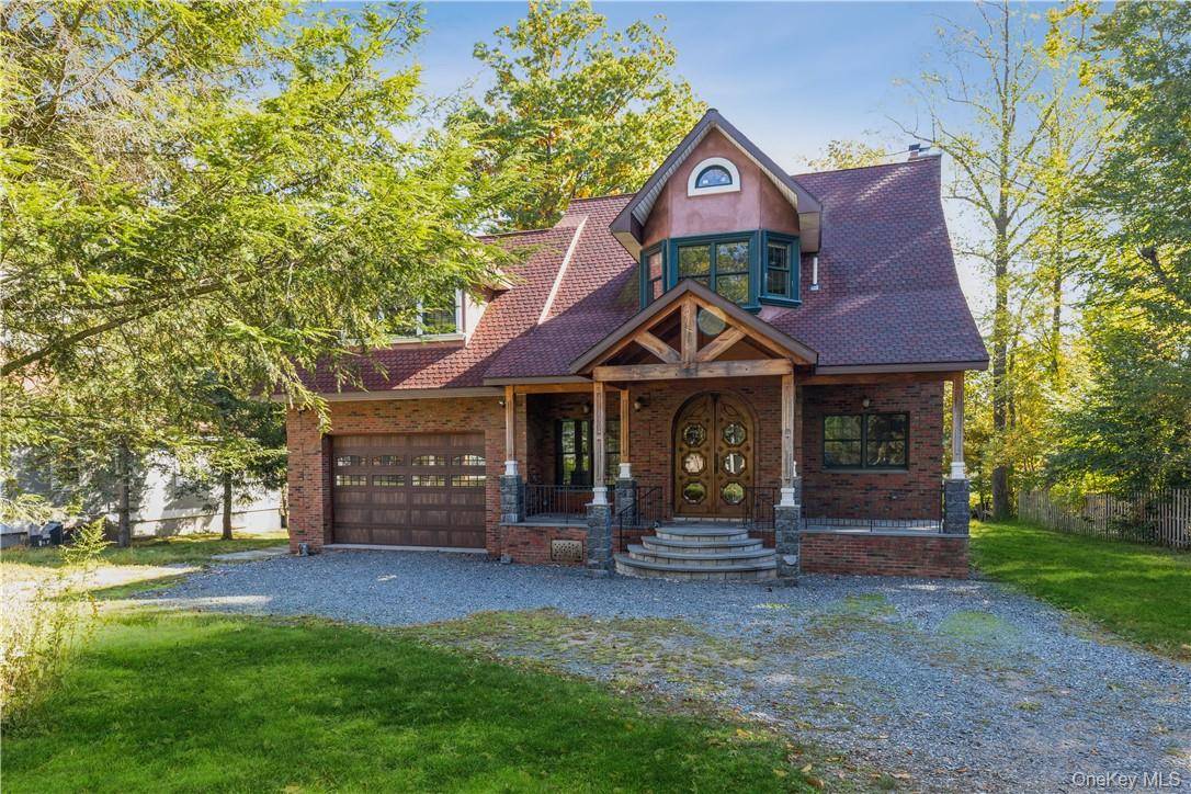 LAKEFRONT GEM Welcome to this spectacular, sun filled 4 bedroom, 3 bath custom Colonial set on 1.