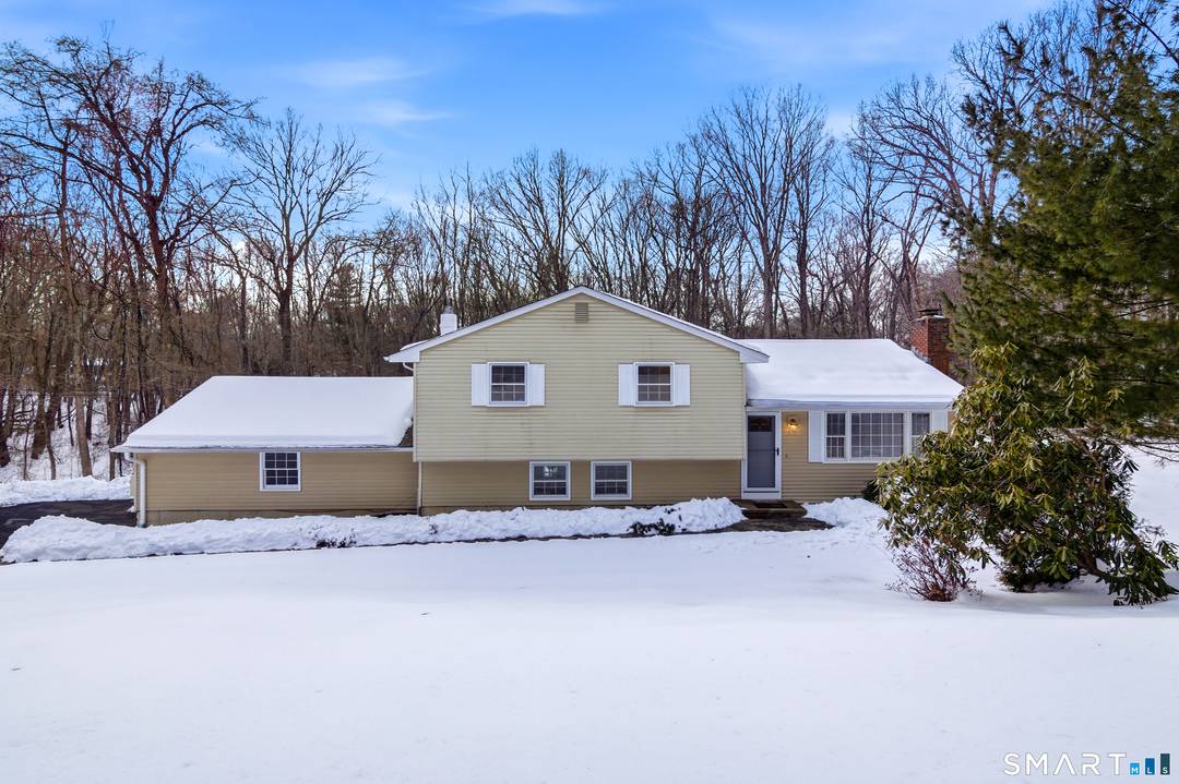 Discover the perfect blend of privacy and modern comfort in this thoughtfully updated split level home.