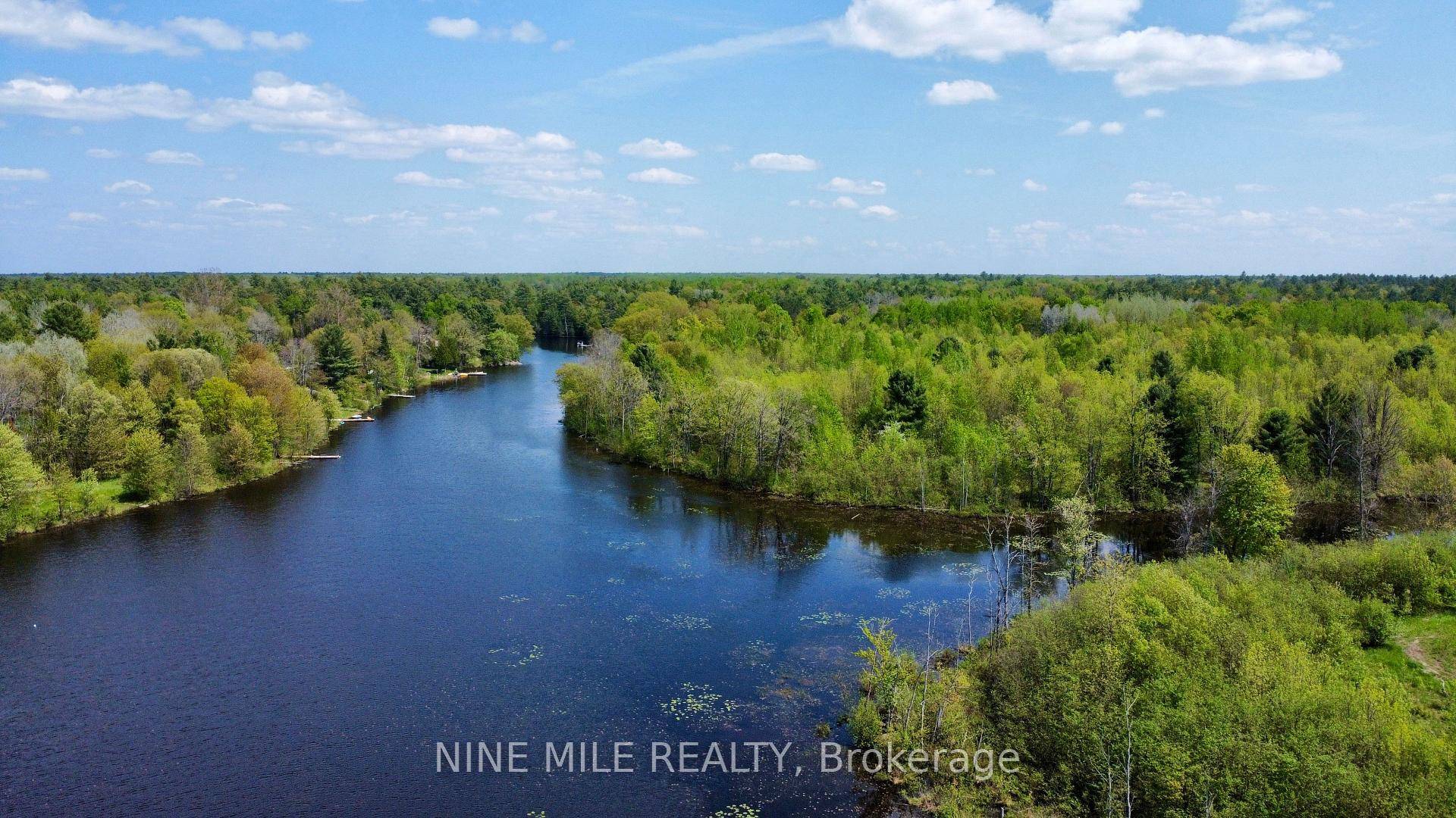 Situated along the serene shores of Boyd's Creek a channel off of the Green River, this 1.