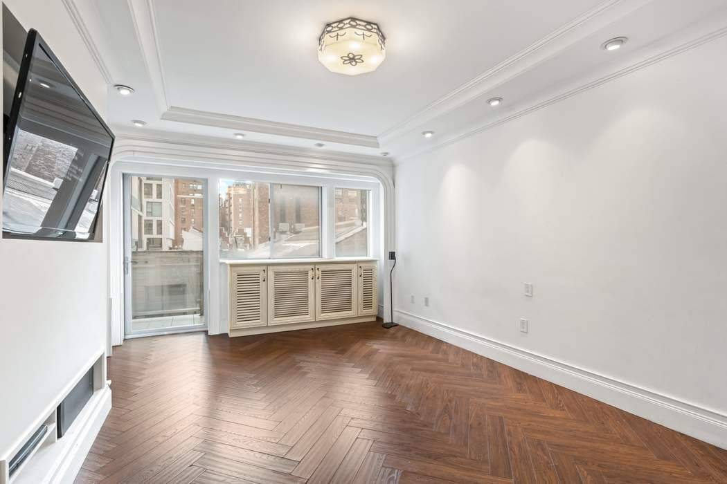 Apartment 9B is a one bedroom with a home office apartment and flooded with sunlight from the southern exposure with large balcony.
