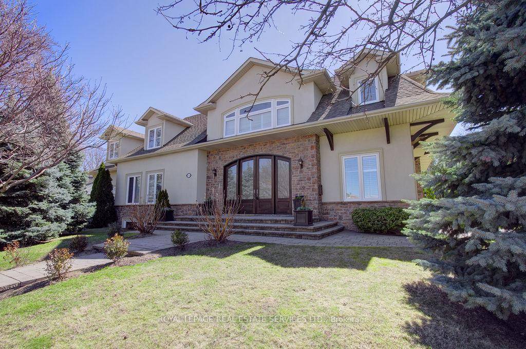 From the moment you step through the 12' mahogany doors into the stunning 2 storey foyer, this home captivates with its rare blend of warmth and grandeur.