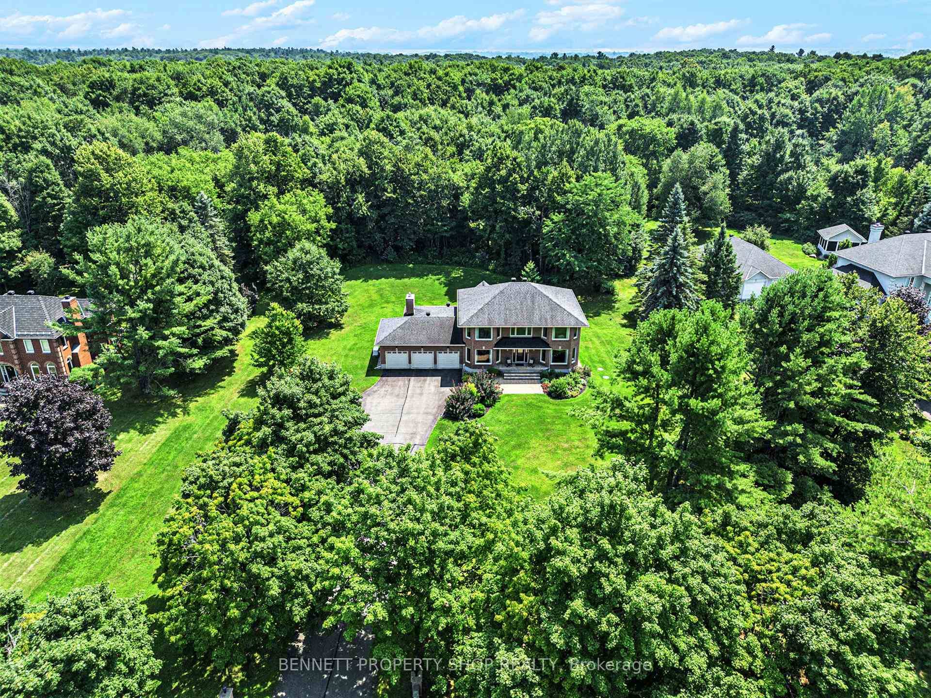 As you arrive at this stunning 2 storey estate tucked away on a serene, treed lot, you'll immediately feel the tranquillity of its wooded surroundings, with the Loch March Golf ...