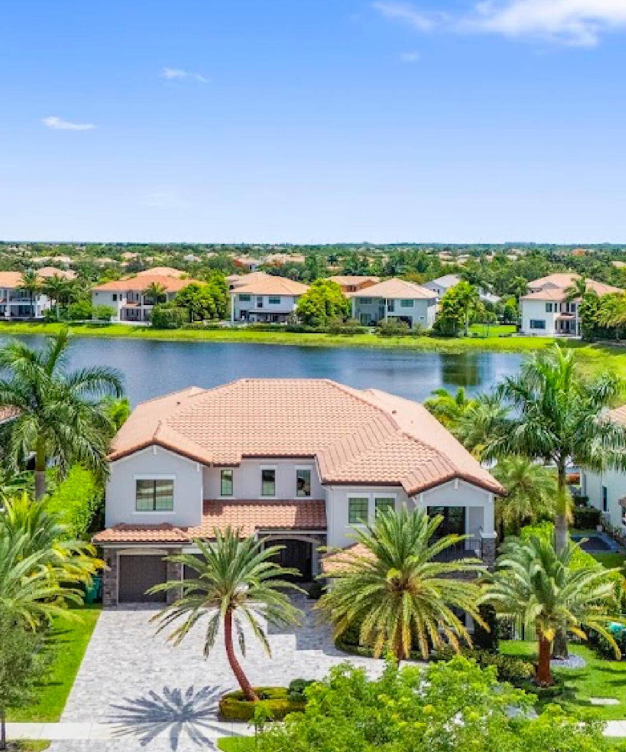 This stunning 5 bed, 6 bath lakefront estate blends modern elegance with resort style living.