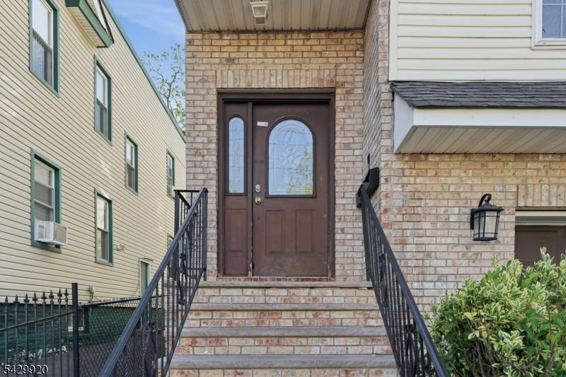 Welcome to this beautiful, well maintained 3 story, legal 2 family home in Newark.