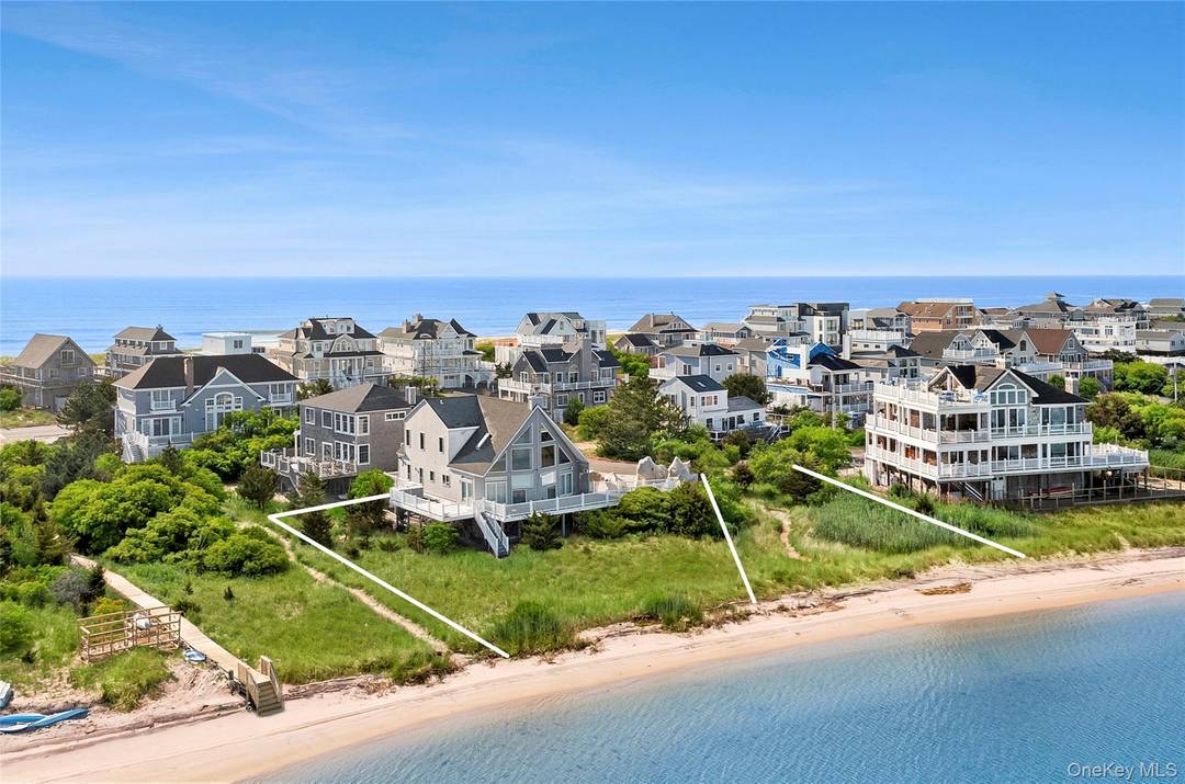 A rare opportunity to own two single and separate bayfront lots tucked just off iconic Dune Road in Westhampton Dunes.