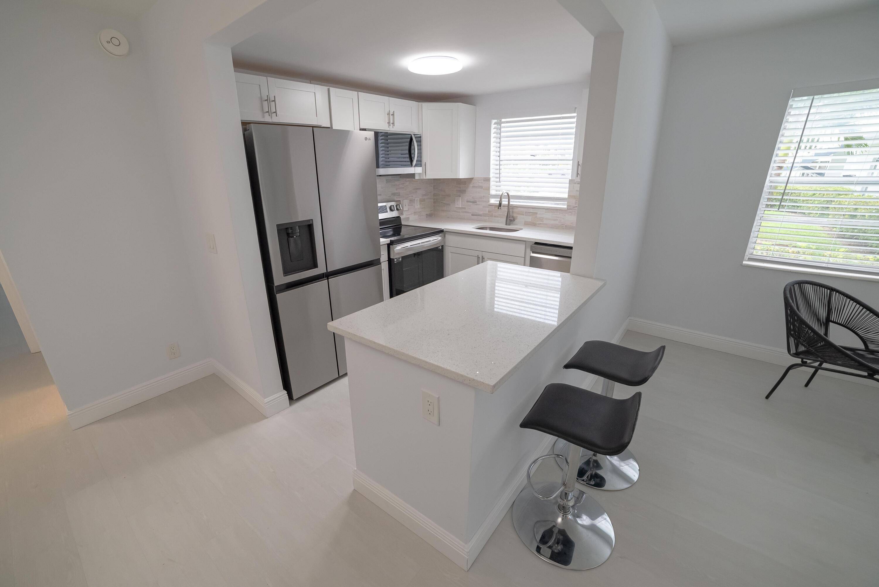 55 Condo First FloorBeautifully updated unit featuring brand new AC, upgraded electrical system, new appliances, and modern vinyl flooring.