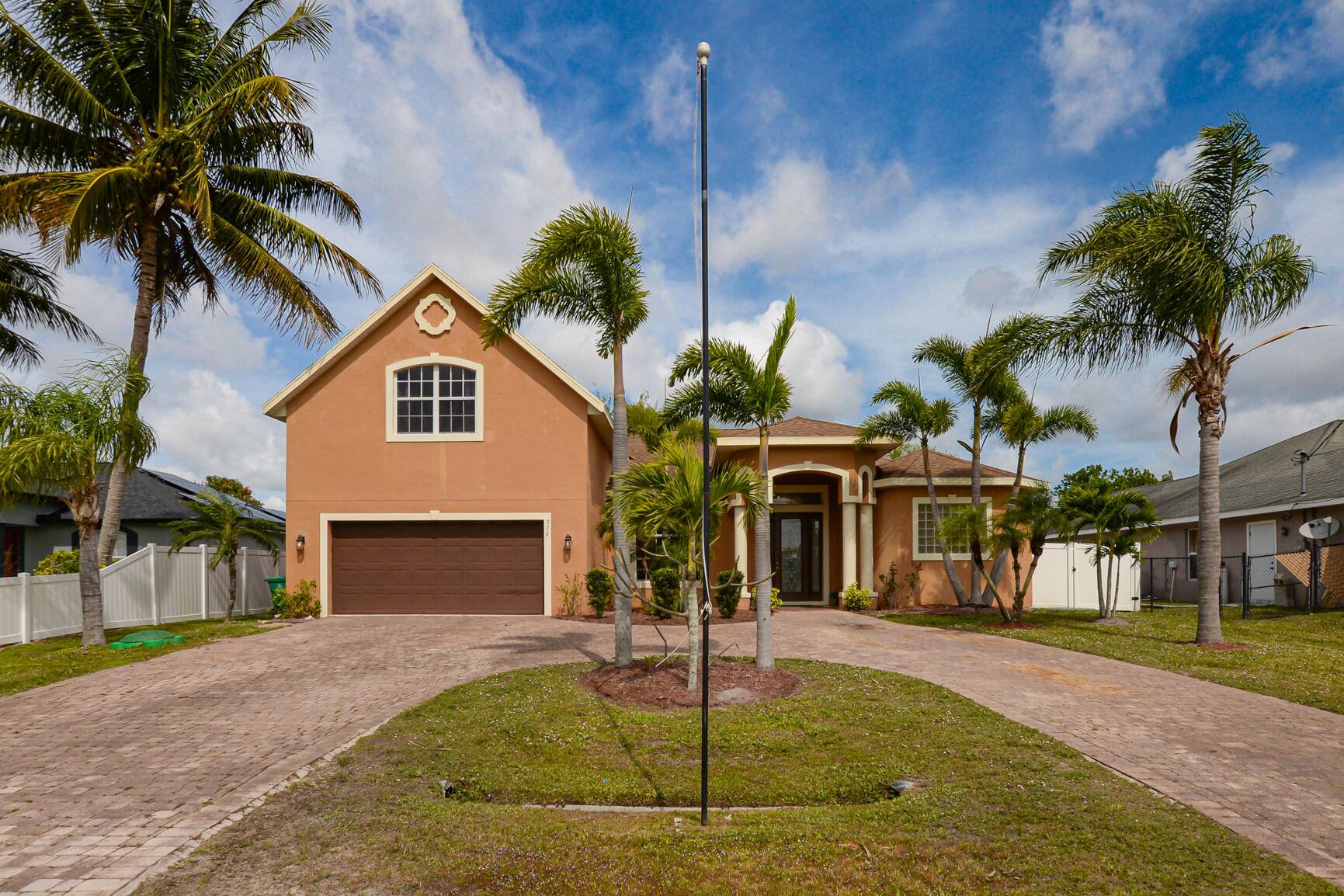 Beautiful 2 Story Pool Home features CBS Construction, circular Paver Driveway private backyard Fence offering Florida living in your own pool.