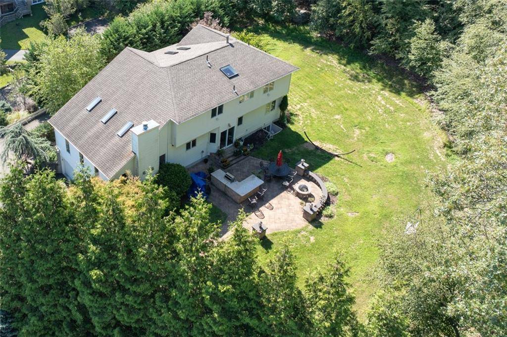 Stunning Colonial with Mountain Views Located beside Patriot Hills Golf Course's 7th hole, this beautiful home features a chef's kitchen with cherry cabinetry, granite countertops, Wolf stove, and Bosch dishwasher.