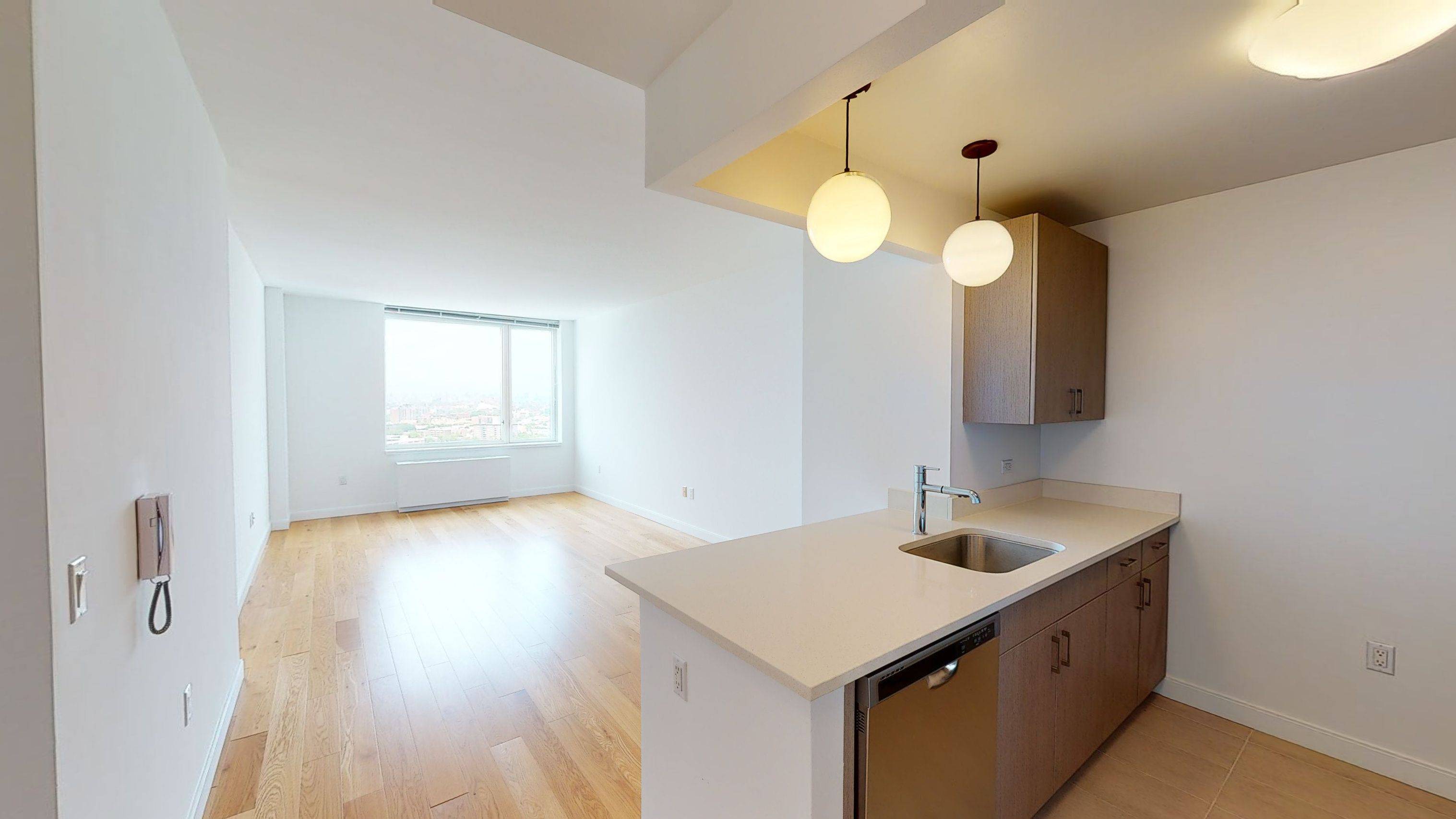 West facing 2 bedroom with oversized windows showcasing Manhattan skyline views.