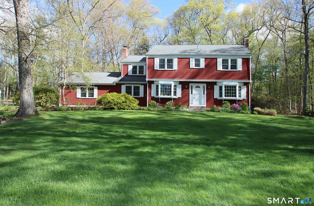 Welcome to this charming and beautifully maintained 9 room Colonial, tucked at the end of a quiet cul de sac and set on over an acre of level, picturesque grounds.