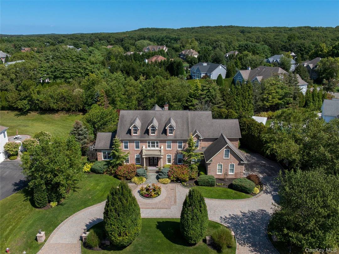 Exuding stately grandeur and refined sophistication, this exceptional 6 bedroom, 5.