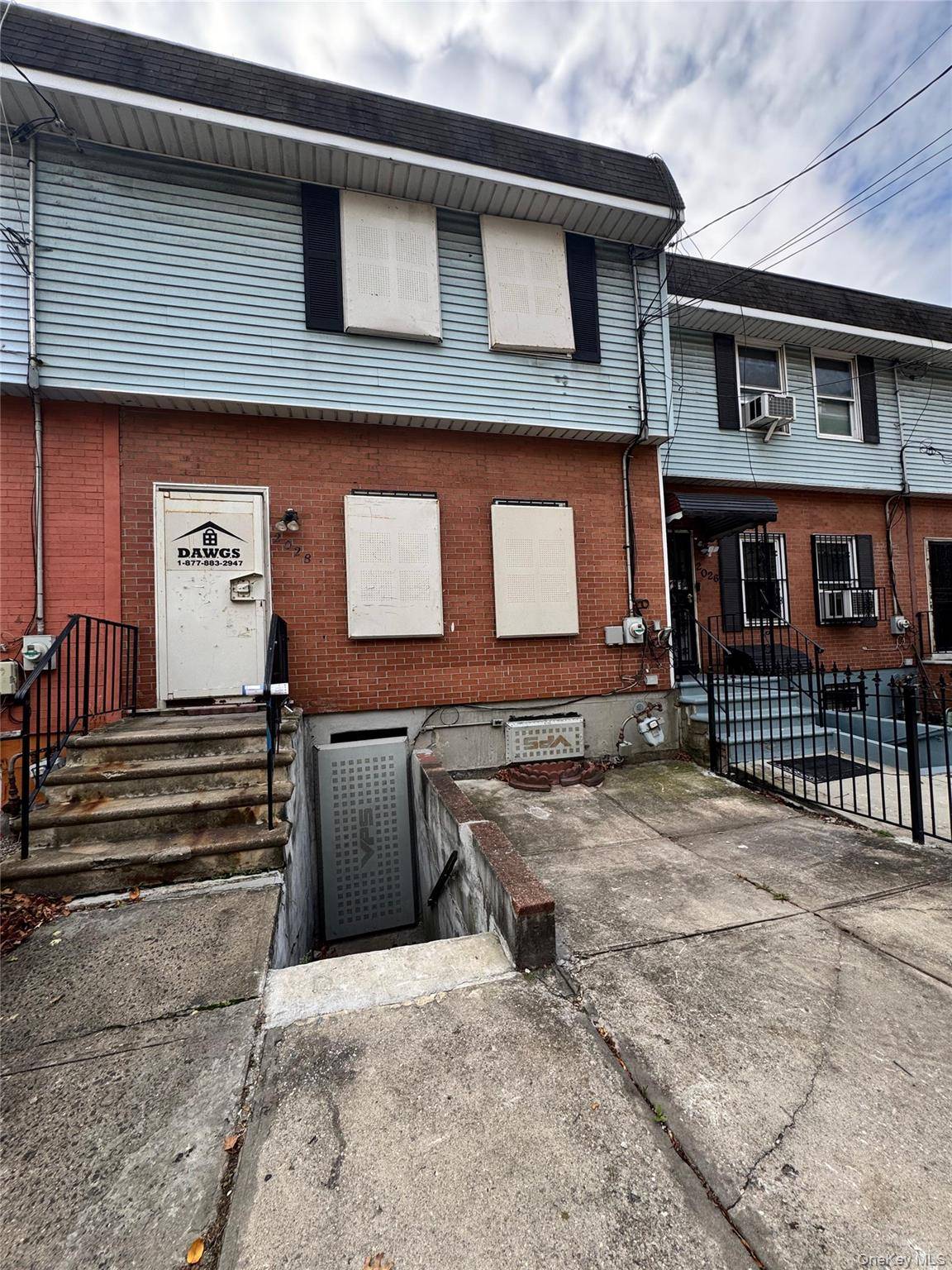 Single Family House features Three bedroom, two and a half bath townhouse with a living room, dining room, and kitchen.