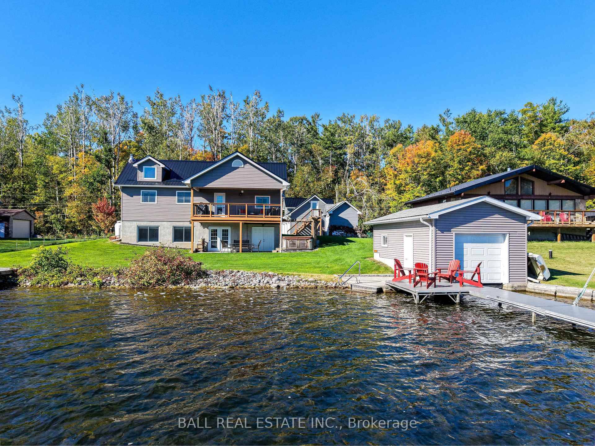 Welcome to this stunning Lower Buckhorn Lake home with a wet slip boat house and three bay garage.