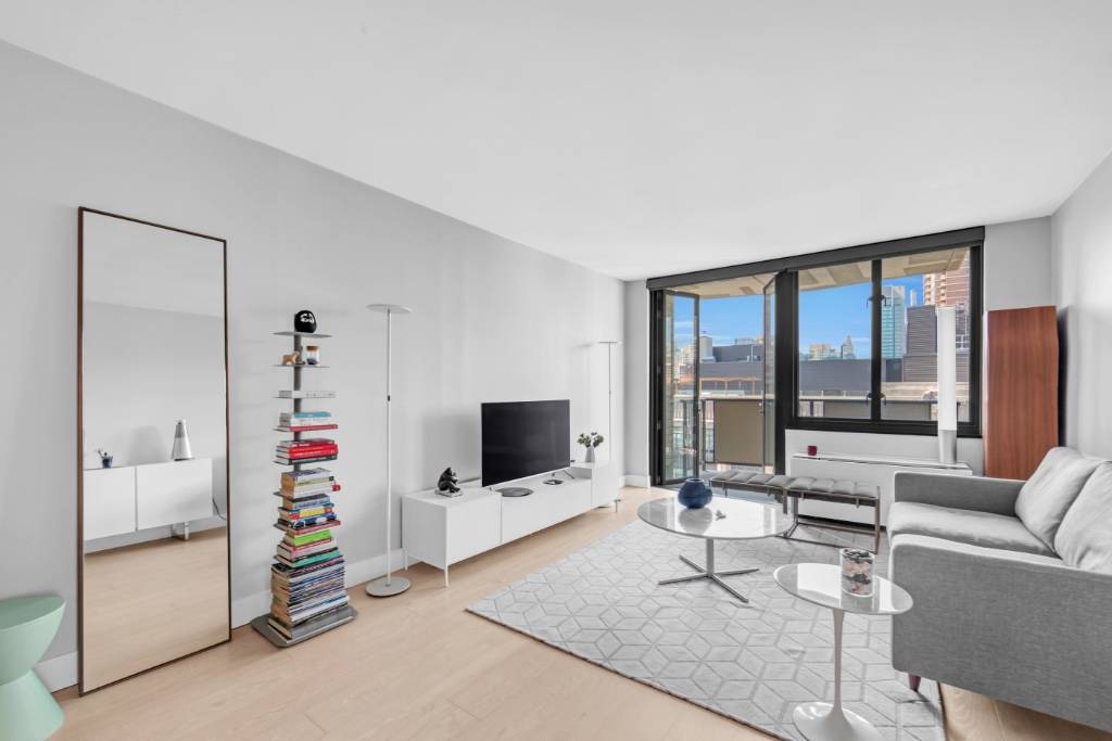 Renovated High Floor 1 Bedroom with Balcony overlooking Park Avenue SouthThis spacious and high floor one bedroom residence boasts a generous layout, including a dedicated dining alcove, entry foyer, and ...