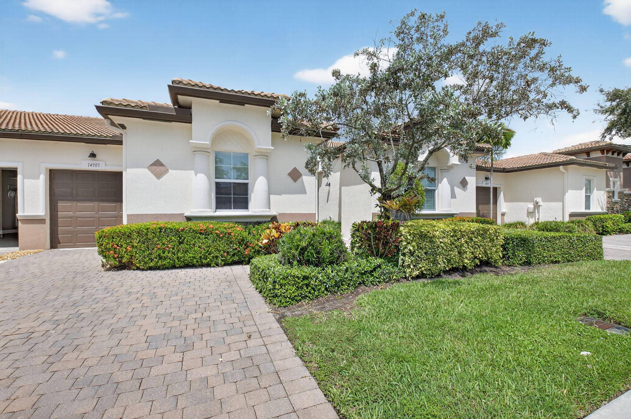 Beautifully upgraded ''Adrano'' 3 bedroom 3 bath and 1 car garage villa on private lushly landscaped lot.